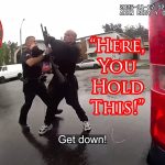 LAPD Officer Practically Hands His Shotgun To Perp
